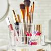 Brother label maker organizing makeup brushes, sponges, and applicators in clear containers