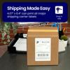 Brother shipping label on cardboard box with label printer and office supplies in background