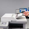 Brother MFC-L5715DW all-in-one laser printer with automatic document feeder in office setting