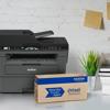 Brother MFC-L2730DW all-in-one laser printer with Refresh toner subscription box on desk