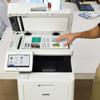 Brother MFC-L9610CDN color laser all-in-one printer with touchscreen scanning documents in office