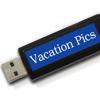 Brother P-touch label maker tape with blue 'Vacation Pics' text on white background