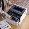 Brother HL-L5210DN monochrome laser printer with open toner compartment showing replacement cartridge