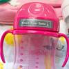 Brother P-touch label on pink sippy cup with personalized name tag