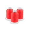 Three spools of bright red embroidery thread on white bases