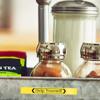Brother TZe label on spice jar with yellow 'Help Yourself' text in organized kitchen
