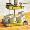 Brother TZe-661 label tape on coffee station organizer with yellow laminated labels