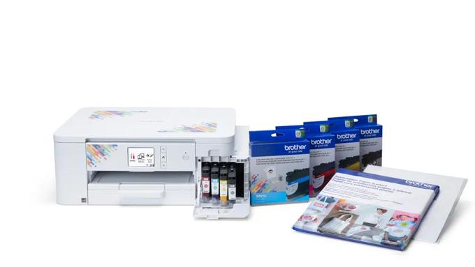 Brother sublimation printer with ink cartridges and transfer sheets on white background