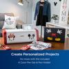 Brother Disney sewing machine with Mickey and Minnie designs on wooden table in craft room