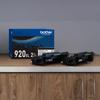 Brother TN920XL 2-pack high-yield toner cartridges with packaging on wooden surface