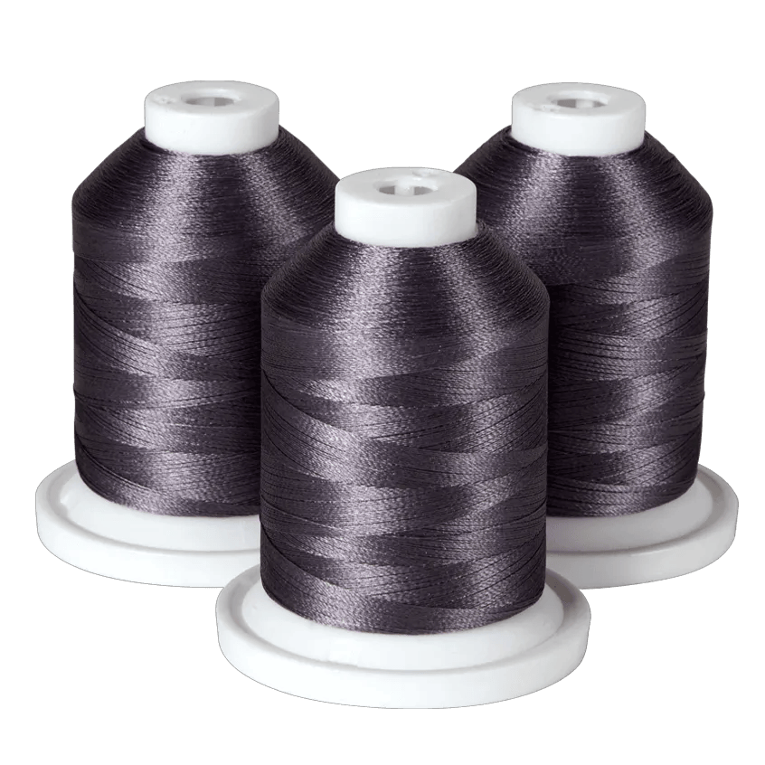 Three spools of dark gray embroidery thread on white bases for Brother sewing machines