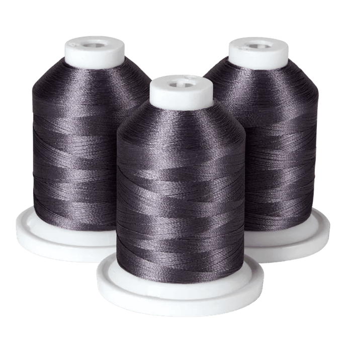 Three spools of dark gray embroidery thread on white bases for Brother sewing machines