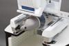 Brother Entrepreneur Pro X embroidery machine with cap frame attachment and baseball cap