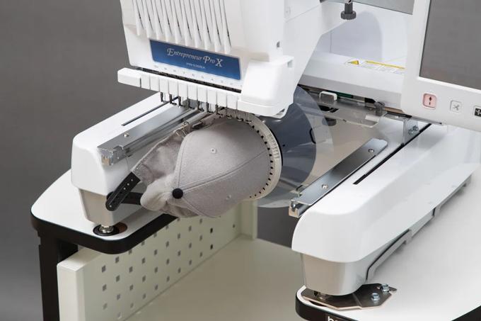 Brother Entrepreneur Pro X embroidery machine with cap frame attachment and baseball cap
