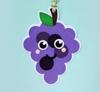 Purple grape plush toy keychain with smiling face and green leaf