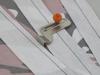 Brother sewing machine presser foot with orange dial on striped fabric
