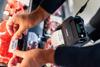 Brother mobile printer labeling fresh meat package in grocery store