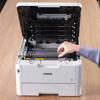 Hand replacing color toner cartridge in Brother HL-L8245CDW wireless laser printer