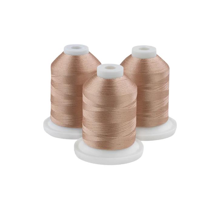 Three beige embroidery thread spools on white bases for sewing and crafting projects
