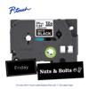 Brother P-touch TZe tape cartridge 24mm matte black with sample labels Friday and Nuts & Bolts