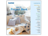 Brother iron-on project book featuring embroidered home decor items with floral designs