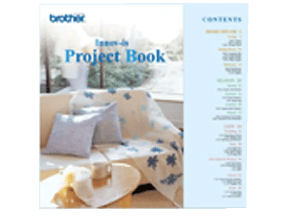 Brother iron-on project book featuring embroidered home decor items with floral designs