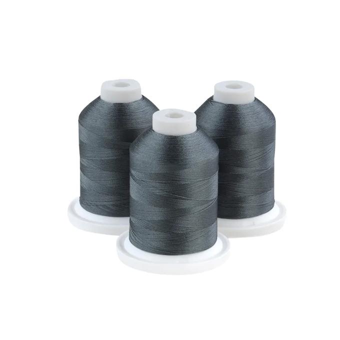 Three spools of blue-grey embroidery thread on white bases