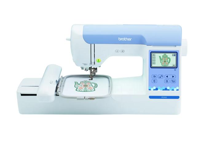 Brother PE900 embroidery machine with touchscreen and teapot design in hoop