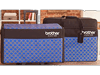 Brother ScanNCut carrying case with blue plaid pattern and storage compartments