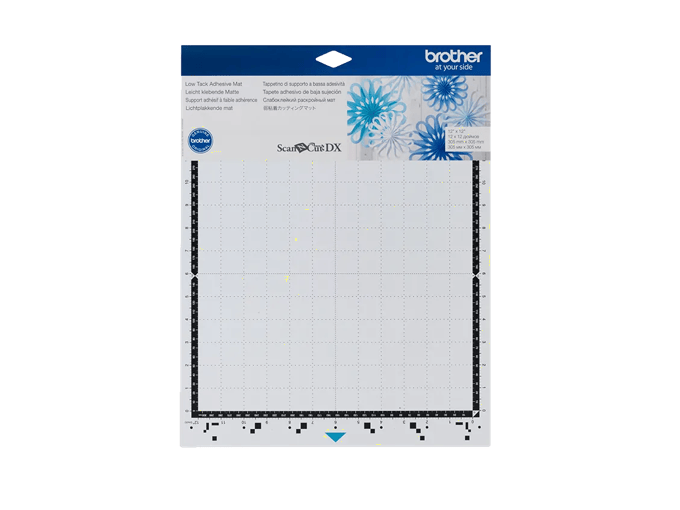 Brother ScanNCut DX low-tack adhesive mat with measurement grid and floral design header
