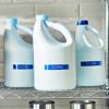 Brother TZe-545 laminated label on bleach, chlorine, and potassium bottles on wire shelf