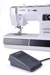 Brother ST371HD heavy-duty sewing machine with electronic foot pedal on white background