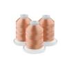 Three spools of peach-colored embroidery thread on white bases