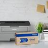 Brother HL-L2350DW monochrome laser printer with Refresh toner subscription box on desk
