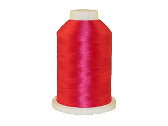 Brother embroidery thread spool in vibrant red polyester on white base