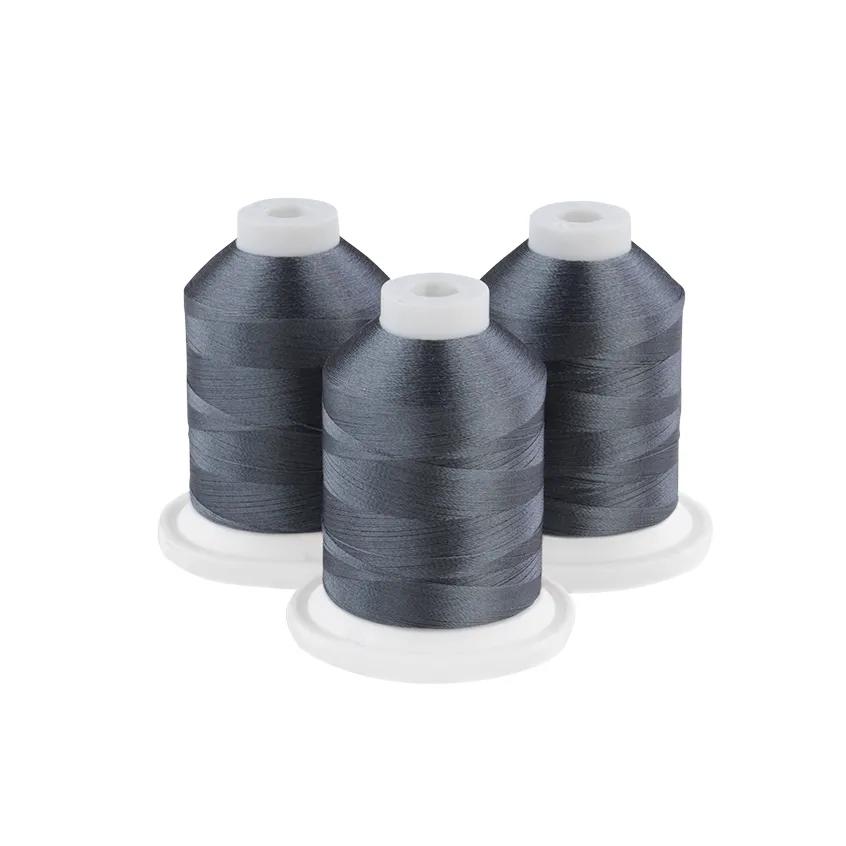 Three gunmetal gray embroidery thread spools on white bases