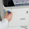 Hand inserting USB drive into Brother MFC-L8905CDW color laser all-in-one printer