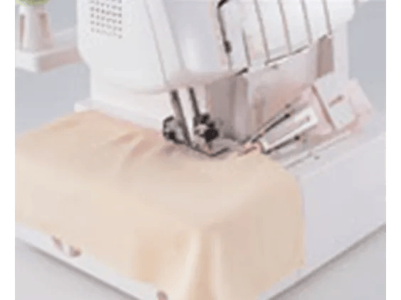 Brother serger sewing machine stitching beige fabric with cover stitch attachment
