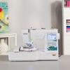 Brother PE535 embroidery machine with touchscreen and floral design panel on white table