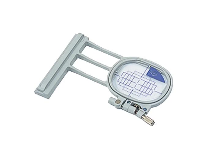 Brother embroidery hoop with oval frame and built-in grid for precise fabric positioning