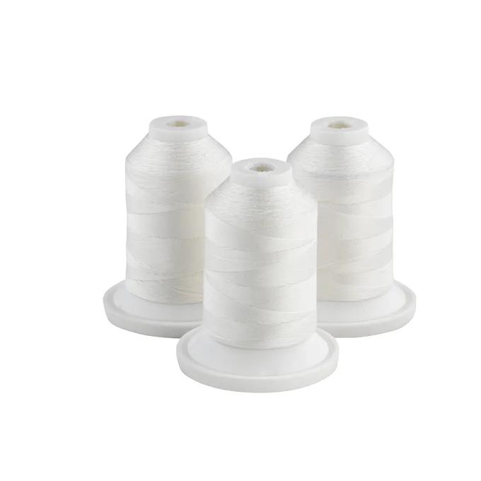 Three white embroidery thread spools on white bases for sewing machines