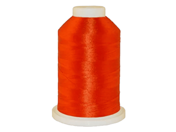 Brother embroidery thread spool in vibrant orange with white cap on cone base
