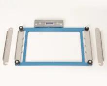 Brother embroidery frame with clamps and adjustment rollers on white background