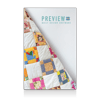 Colorful patchwork quilt with floral and geometric patterns displayed on white background