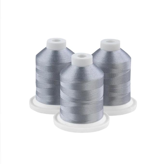 Brother embroidery thread spools in metallic grey on white bases