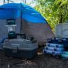 Brother portable label maker with storage cases and supplies at outdoor campsite