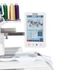 Brother embroidery machine with touchscreen displaying butterfly design and thread spools