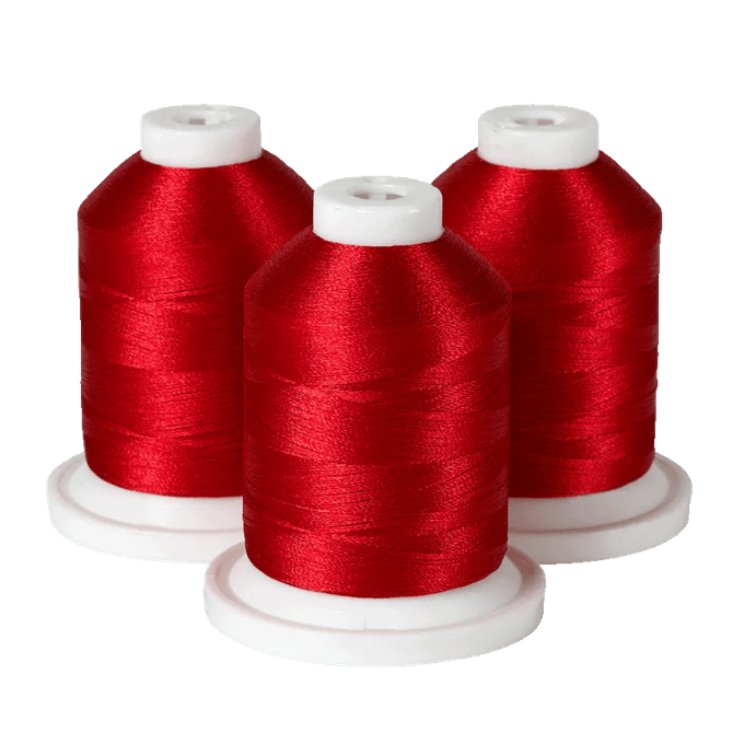 Three spools of red embroidery thread on white bases for Brother sewing machines