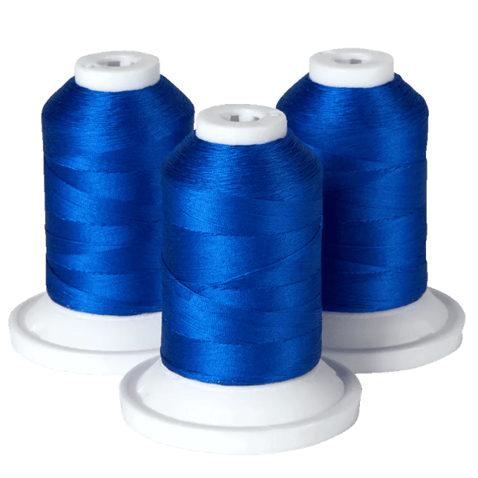 Three spools of blue embroidery thread on white bases for Brother sewing machines
