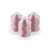 Three spools of pink embroidery thread on white bases
